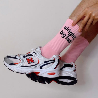 alright big lad black writing on pink sock