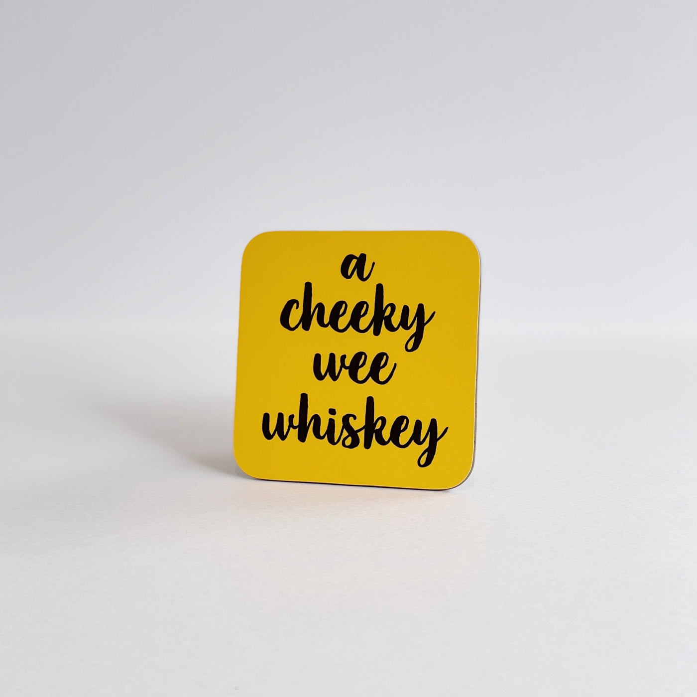 a cheeky wee whiskey coaster yellow